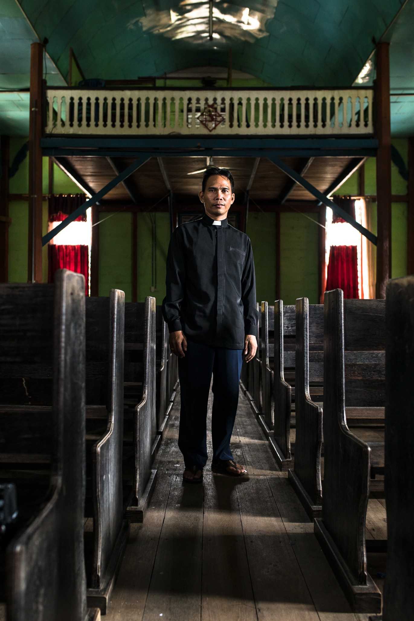 Photo of Mariyady, a priest assigned to Gunung Mas. He investigated the compensation CBIP paid to farmers and described it as “murder”