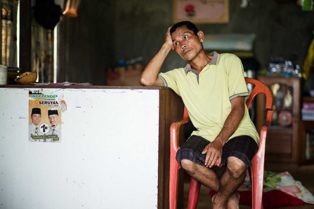 James Watt at his home in Bangkal. The poster on the left is a relic of the 2013 election campaign.