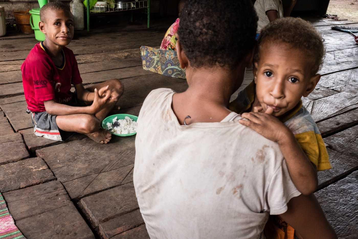 A 26-year-old woman with her sons in Kindiki.
